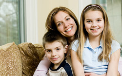 photo of mother with son and daughter